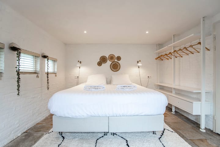 Bedroom with king-size bed and natural decor